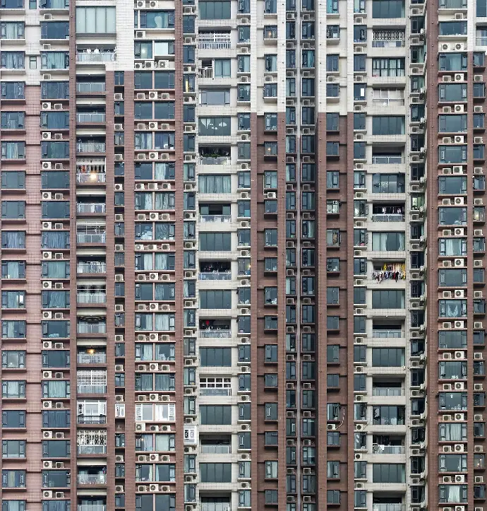 photo of brown and white high-rise building